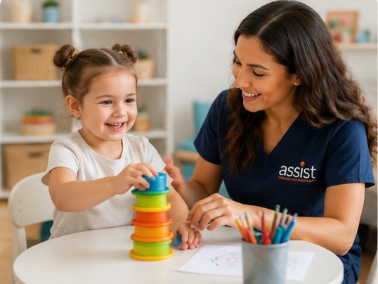 Pediatric occupational therapist helping a child practice fine-motor and play skills